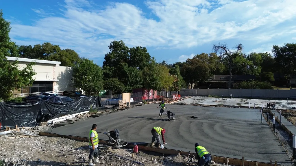 Crew finishing a commercial slab