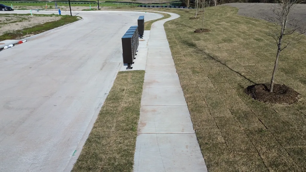 Sidewalk beside a community mailbox area