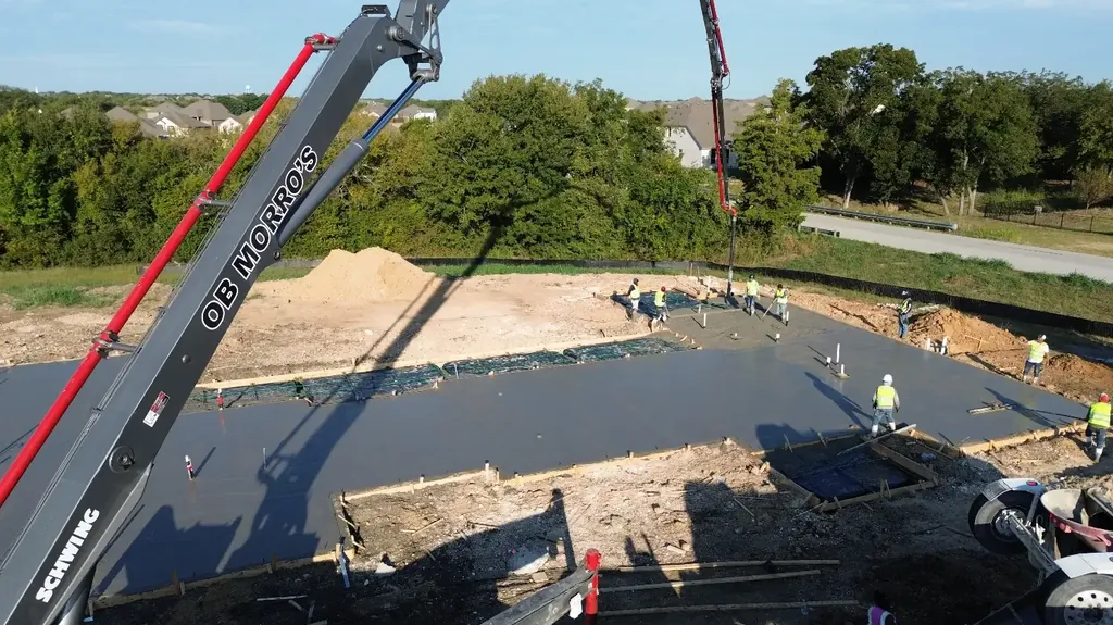 Pump boom placing a residential foundation