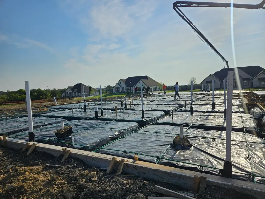 Pump boom over a prepared foundation