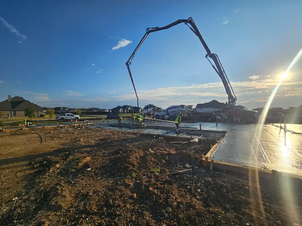 Pump boom over a foundation pour