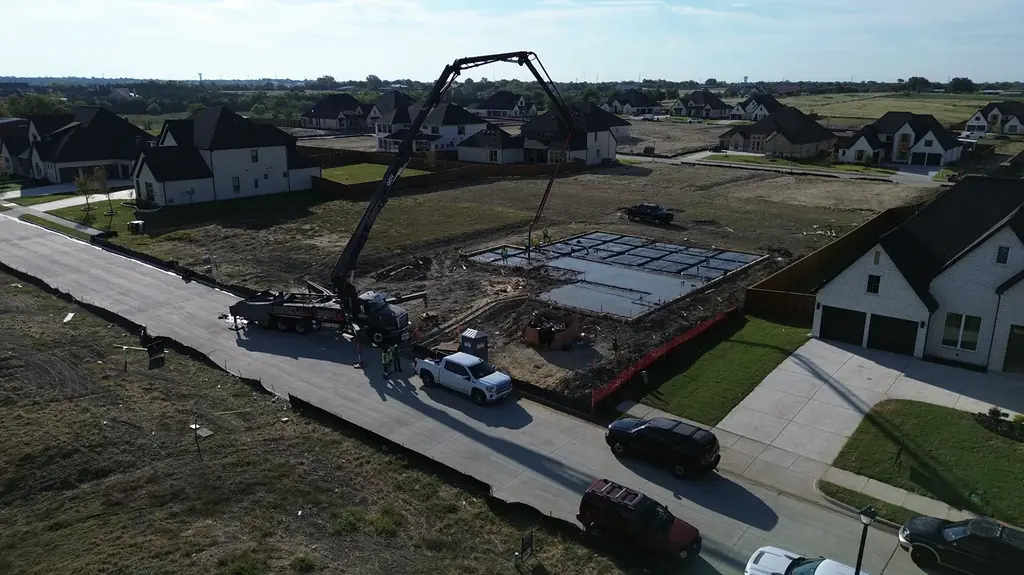 Pump boom at a foundation pour (aerial)